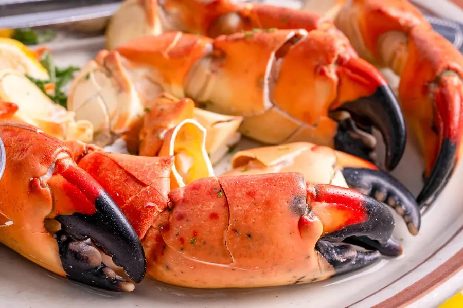 Waterfront drinks and seafood table at Little Bar Goodland